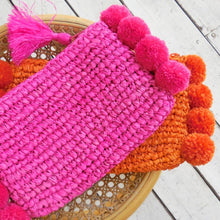 Load image into Gallery viewer, Brunna Canggu Woven Straw Clutch - in Hot Pink Raffia &amp; Pom-poms
